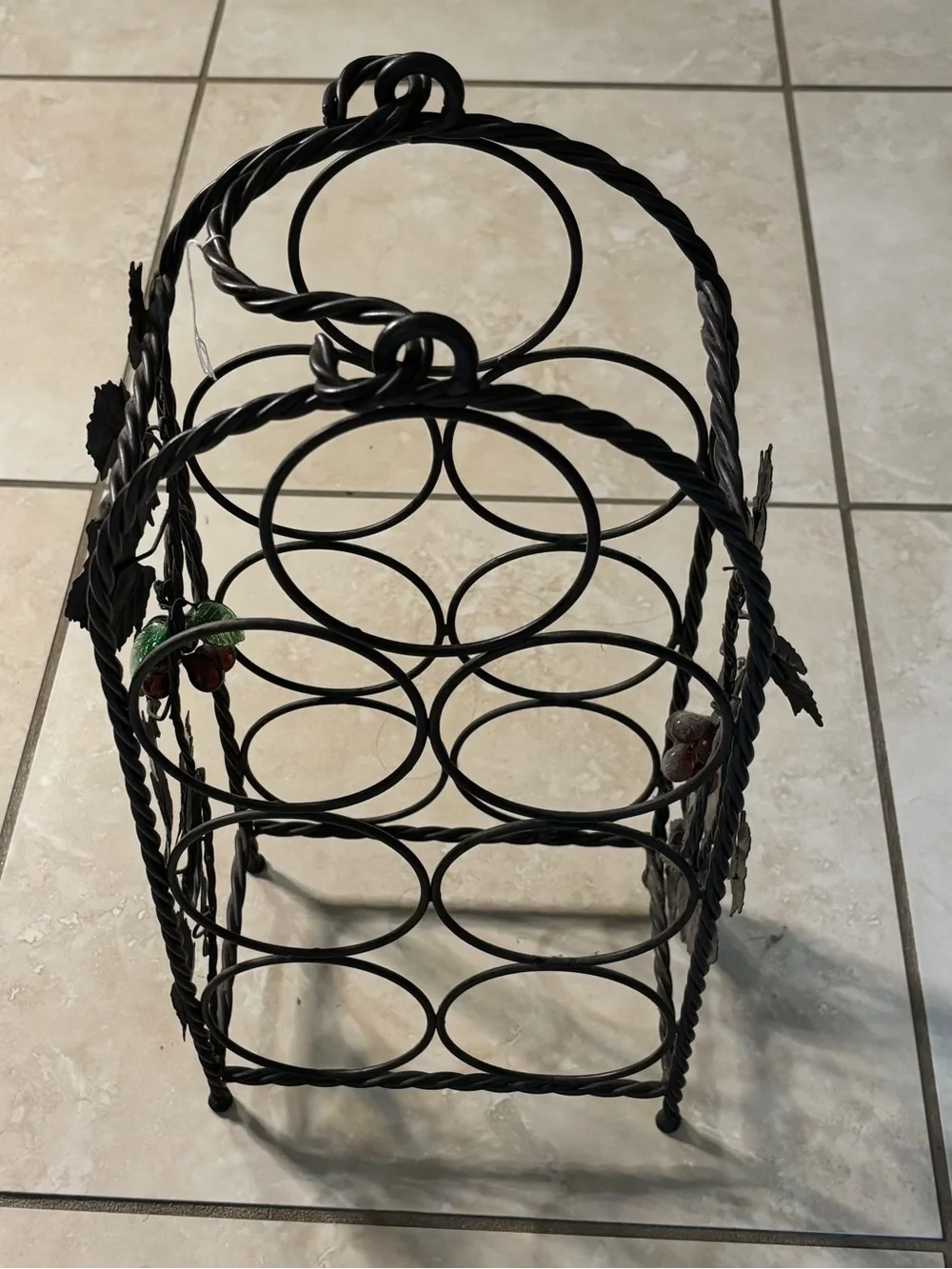 Black Metal Wine Bottle Rack with Decorative Leaf Accents